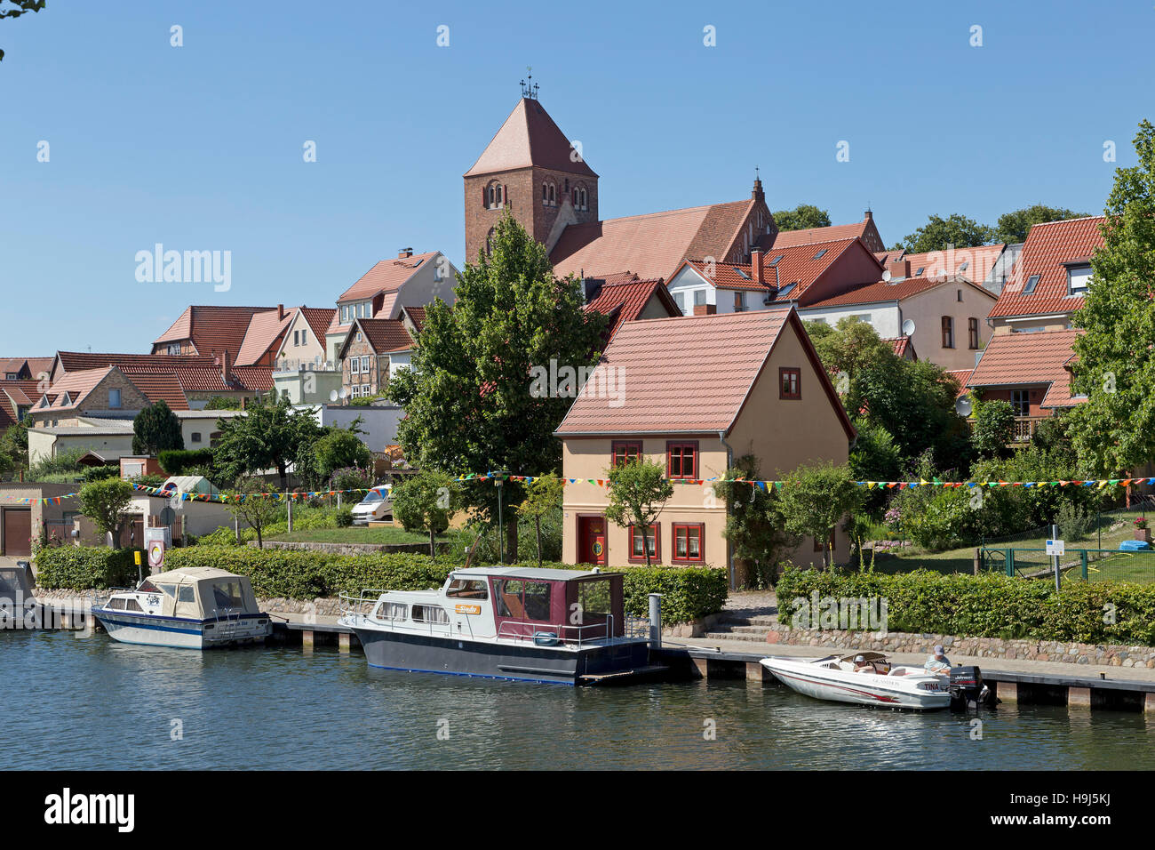 church and River Elde, Plau am See, Mecklenburg Lakes, Mecklenburg-West Pomerania, Germany Stock Photo