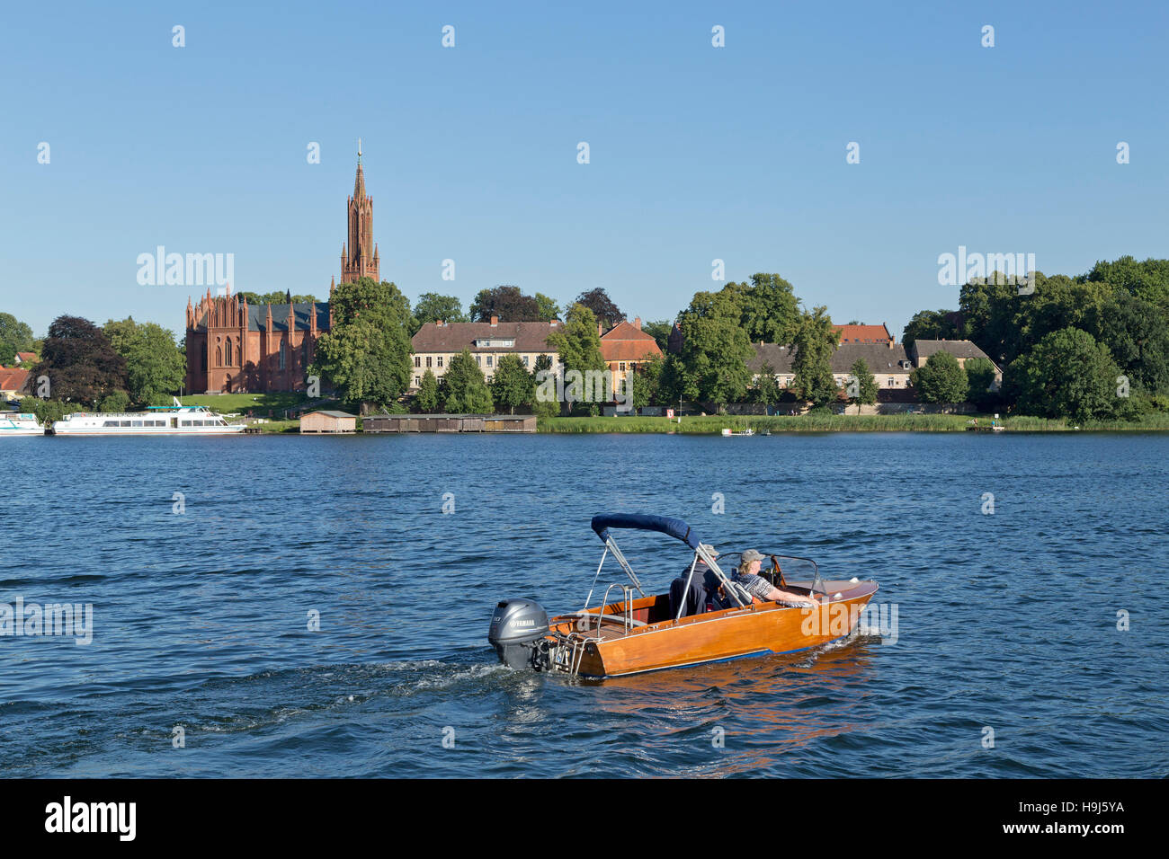 church and lake, Malchow, Mecklenburg Lakes, Mecklenburg-West Pomerania, Germany Stock Photo