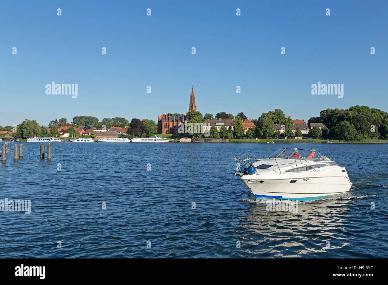 church and lake, Malchow, Mecklenburg Lakes, Mecklenburg-West Pomerania, Germany Stock Photo