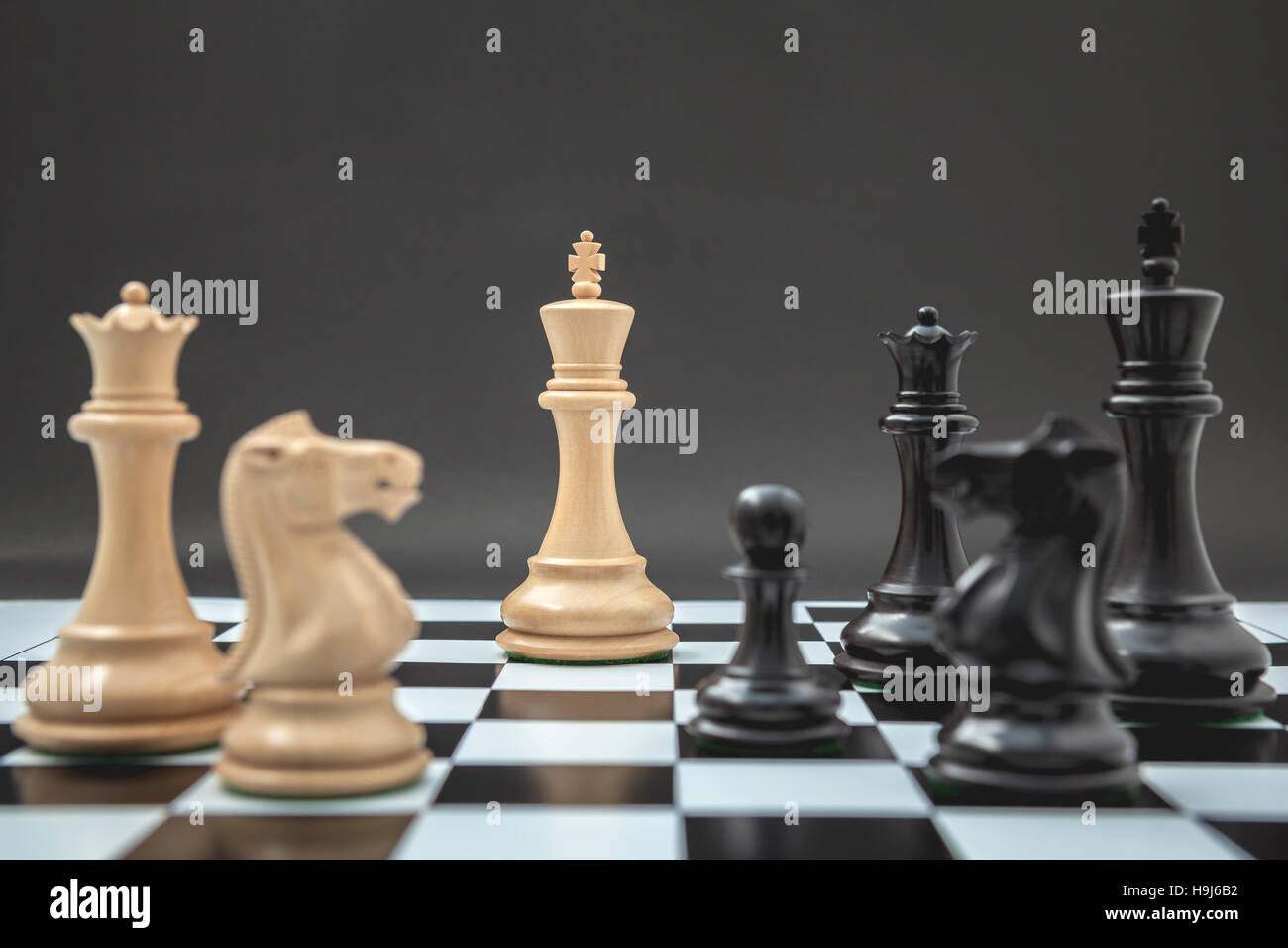 Black and White King and Knight of chess setup on Chessboard and Stock