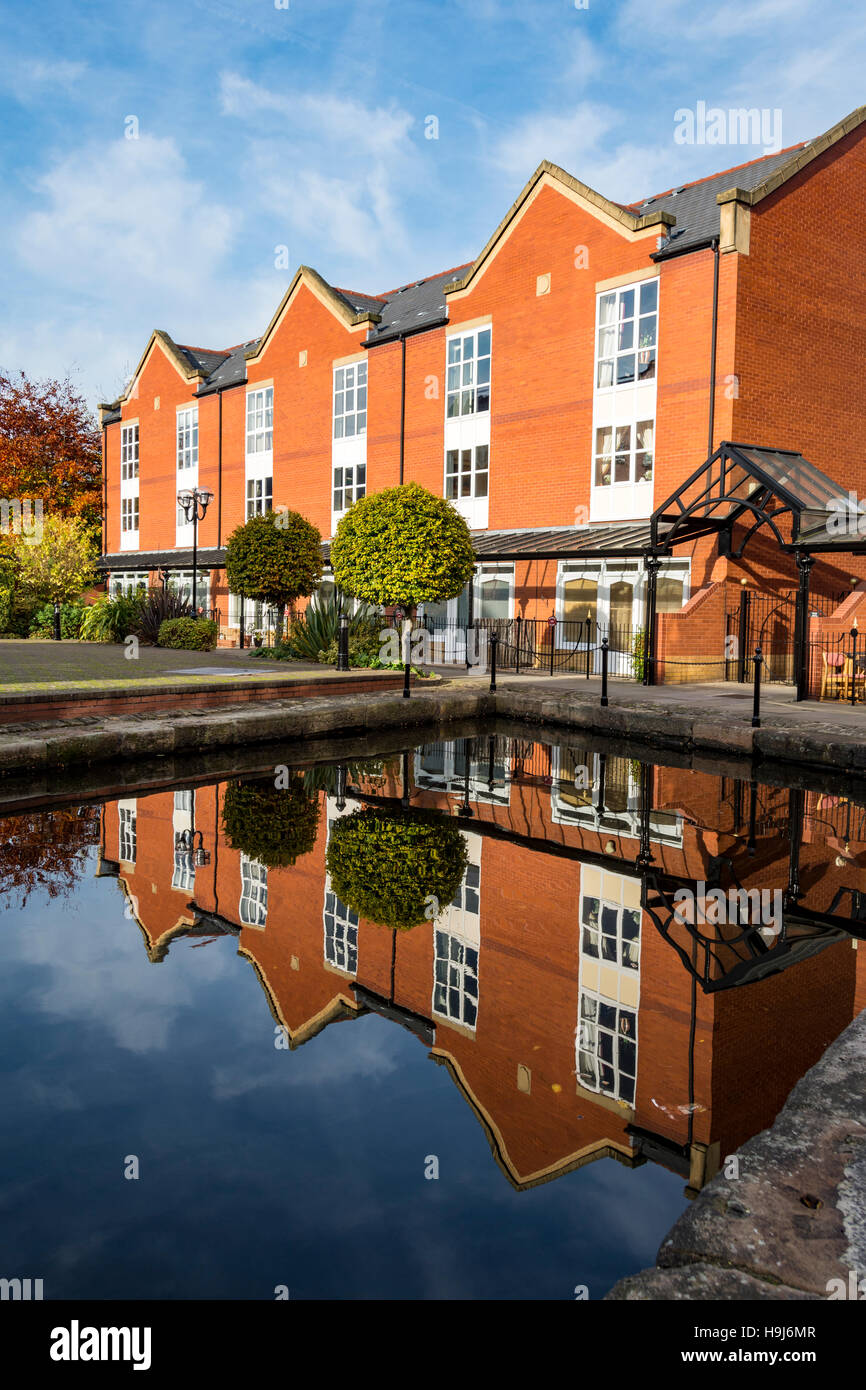 Canal side housing at the Piccadilly Village development, near the city