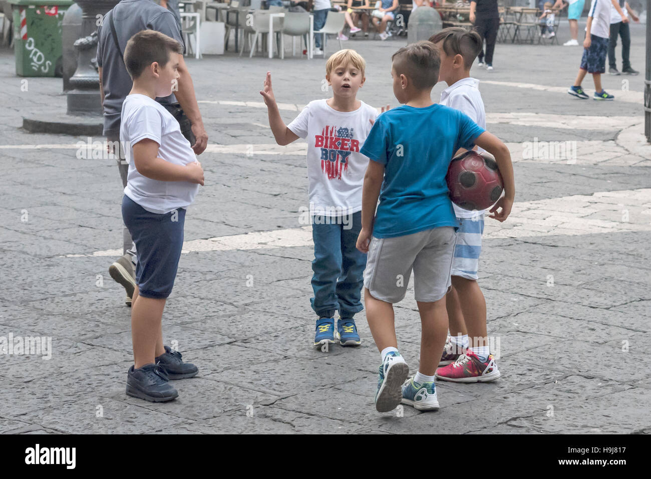 Team of young soccer players discuss match, of Naples, Naples; southern Ital Stock Photo