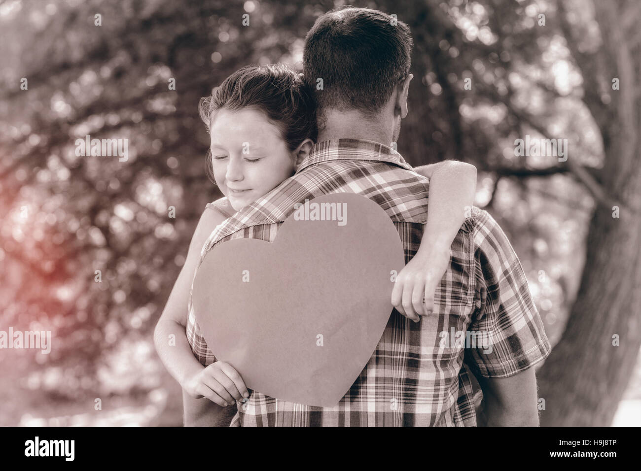Father and daughter hugging in the park Stock Photo - Alamy