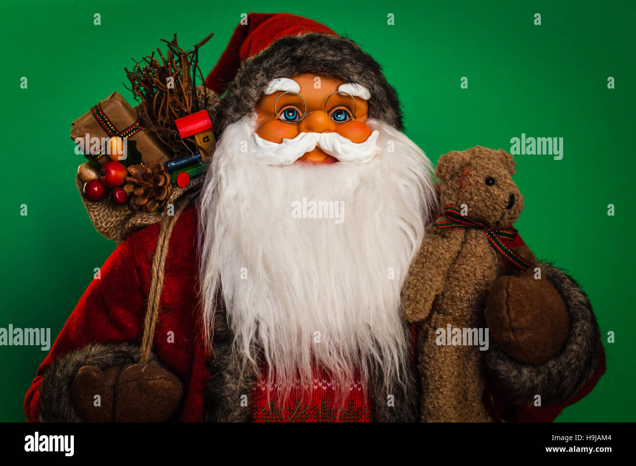 Santa Claus upper body close up with green background. Stock Photo
