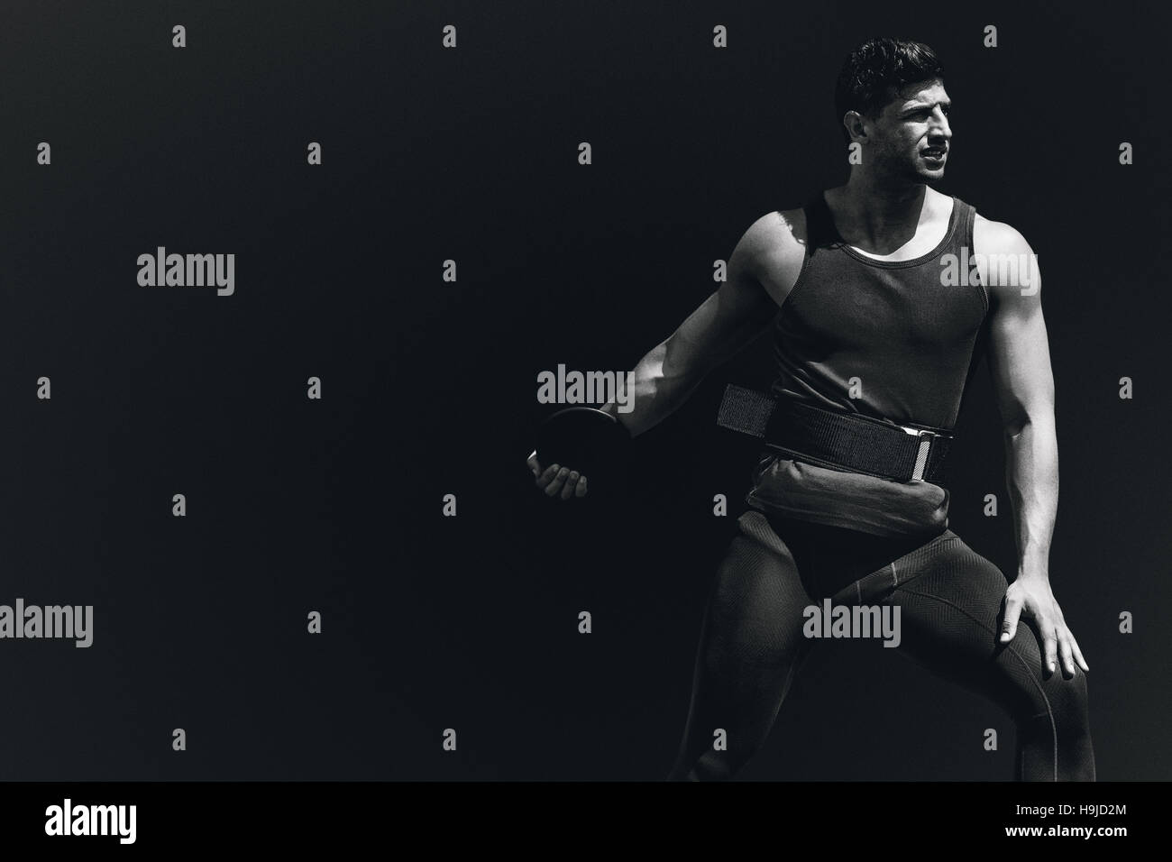 Composite image of portrait of sportsman practising discus throw Stock Photo