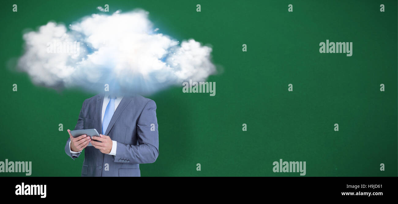 Composite image of businessman using tablet Stock Photo