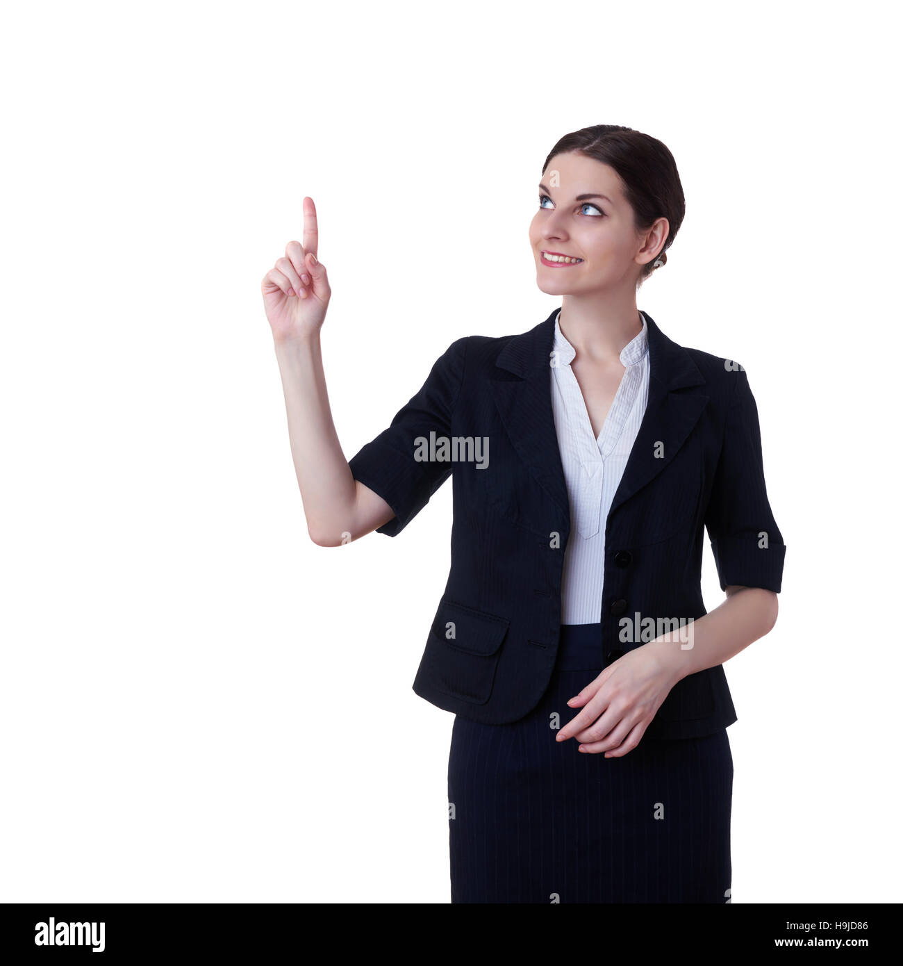 Smiling businesswoman standing and pointing over white isolated background, business, education, office concept Stock Photo