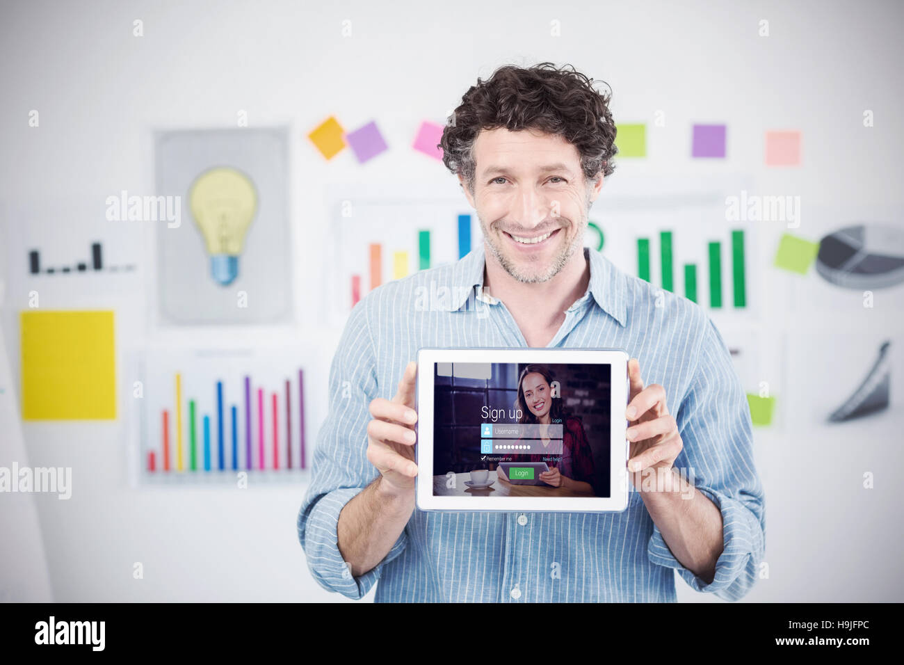 Composite image of businessman showing digital tablet with blank screen ...