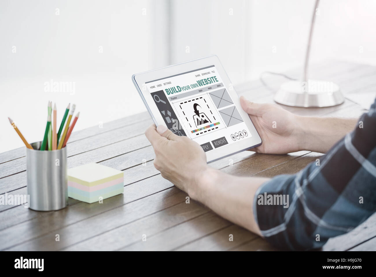 Build interface hands holding hi-res stock photography and images - Alamy