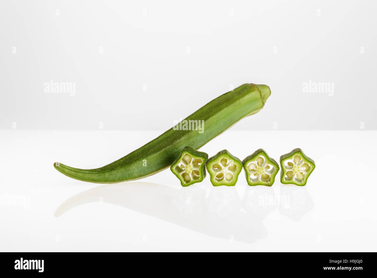Whole and sliced Okra Stock Photo