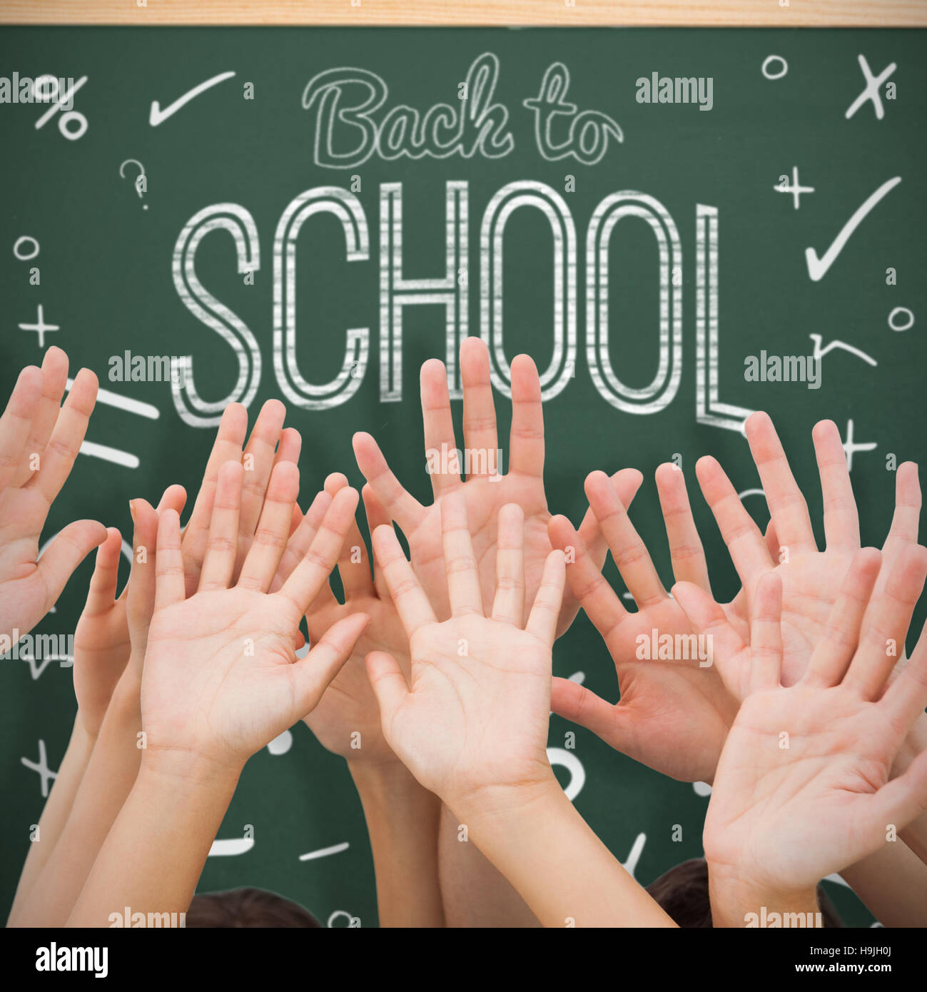 Composite image of people raising hands in the air Stock Photo - Alamy