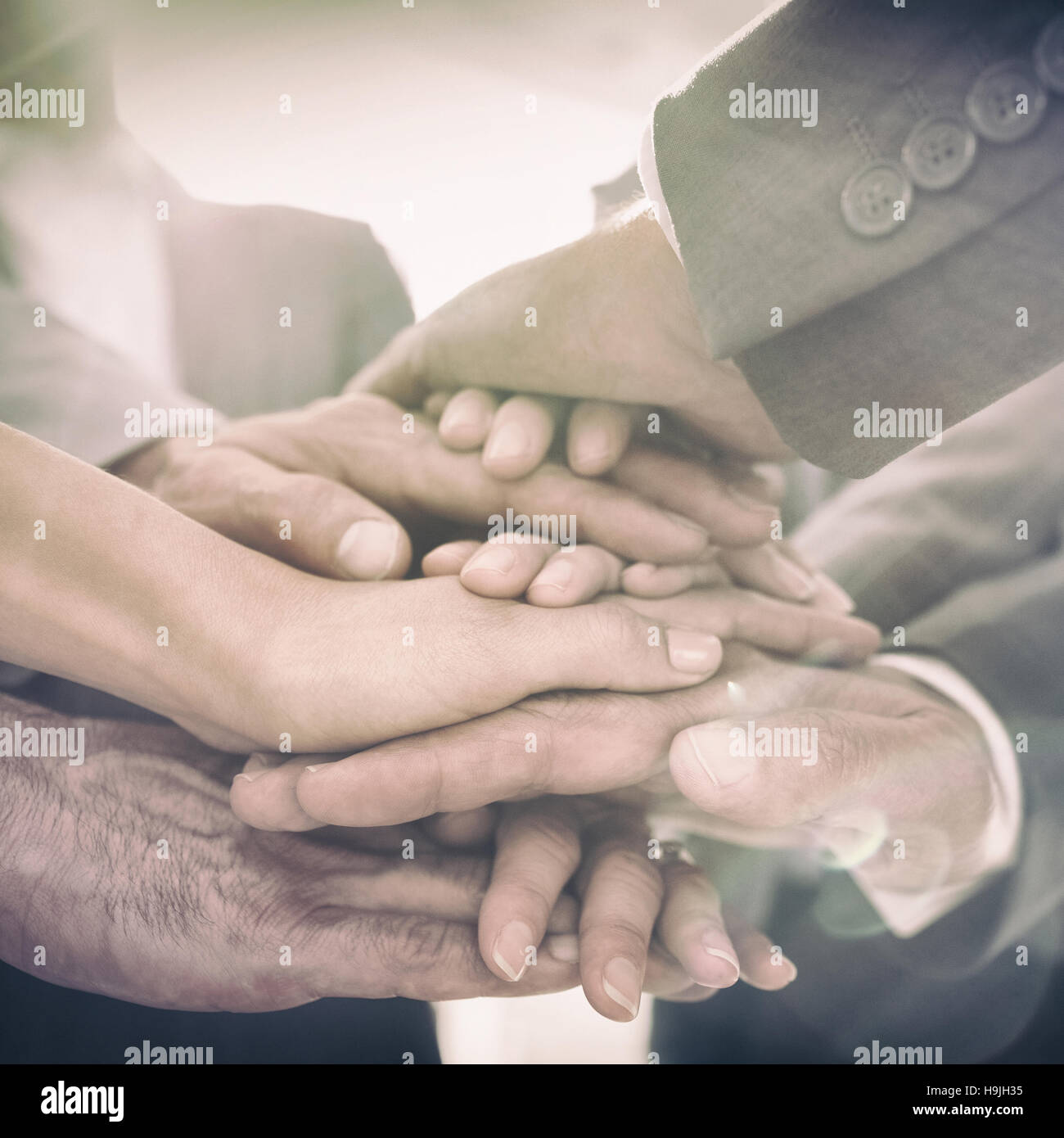 Business team standing hands together Stock Photo
