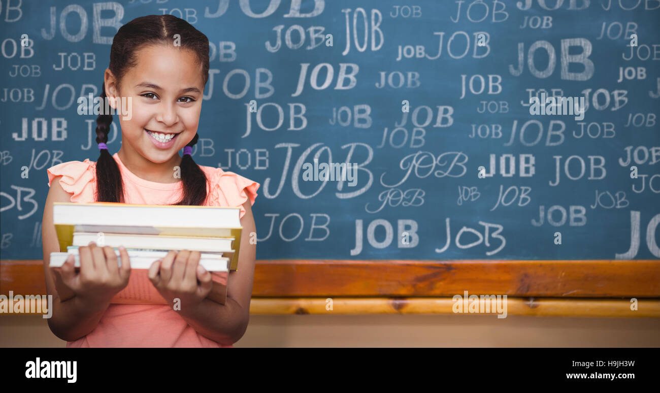 Composite image of school girl holding books Stock Photo - Alamy