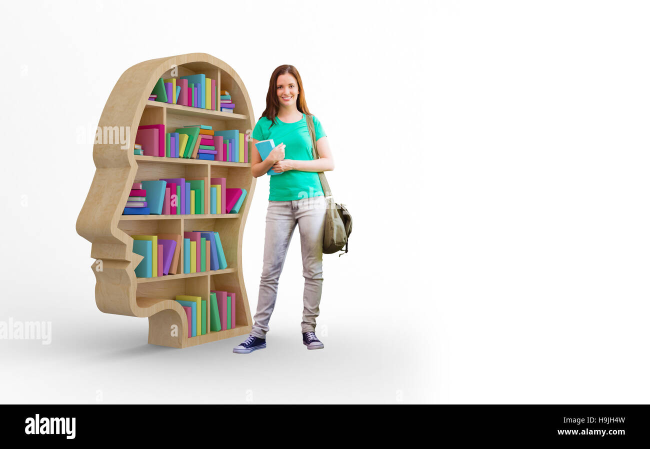 Composite image of student smiling at camera in library Stock Photo - Alamy