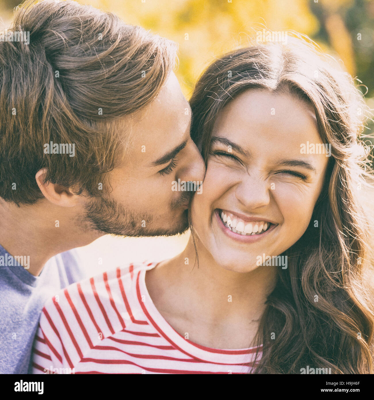 Cute couple kissing hi-res stock photography and images - Alamy
