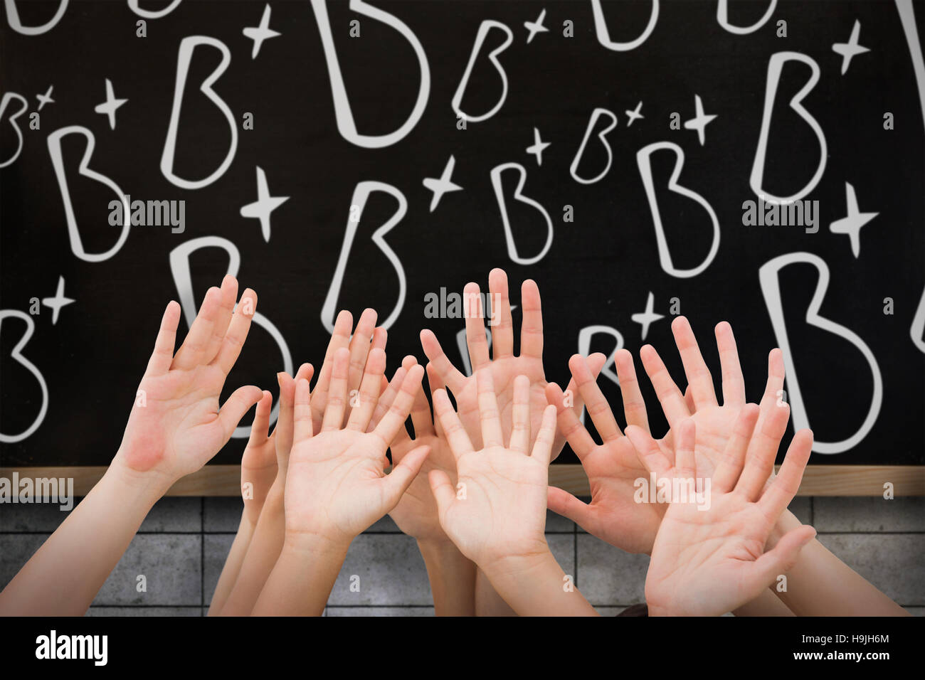 Composite image of people raising hands in the air Stock Photo