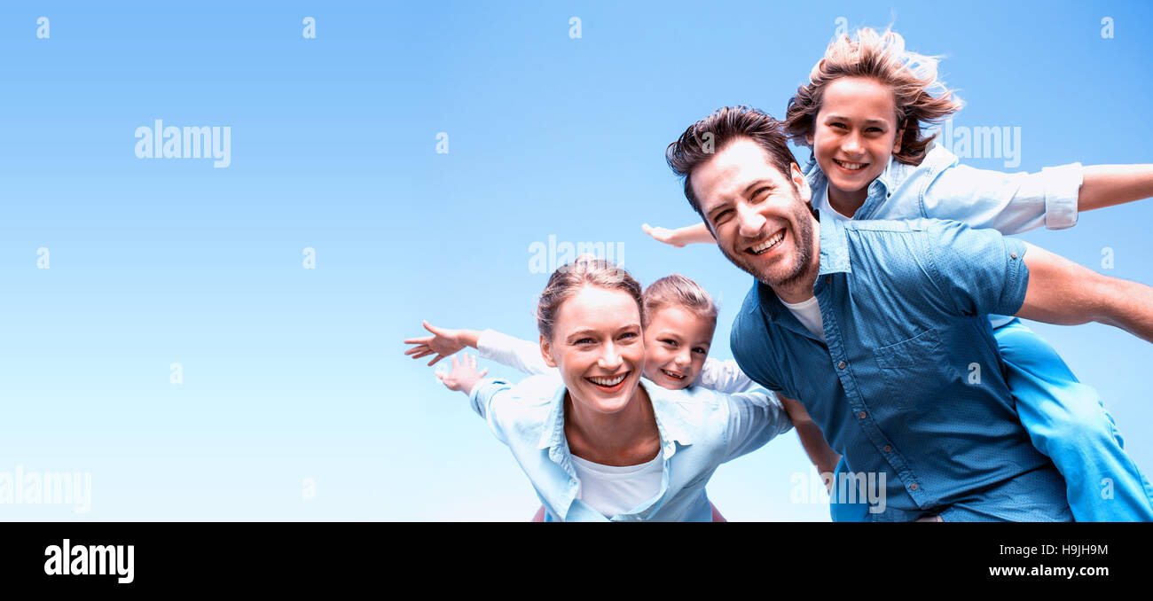 Happy parents with their children Stock Photo