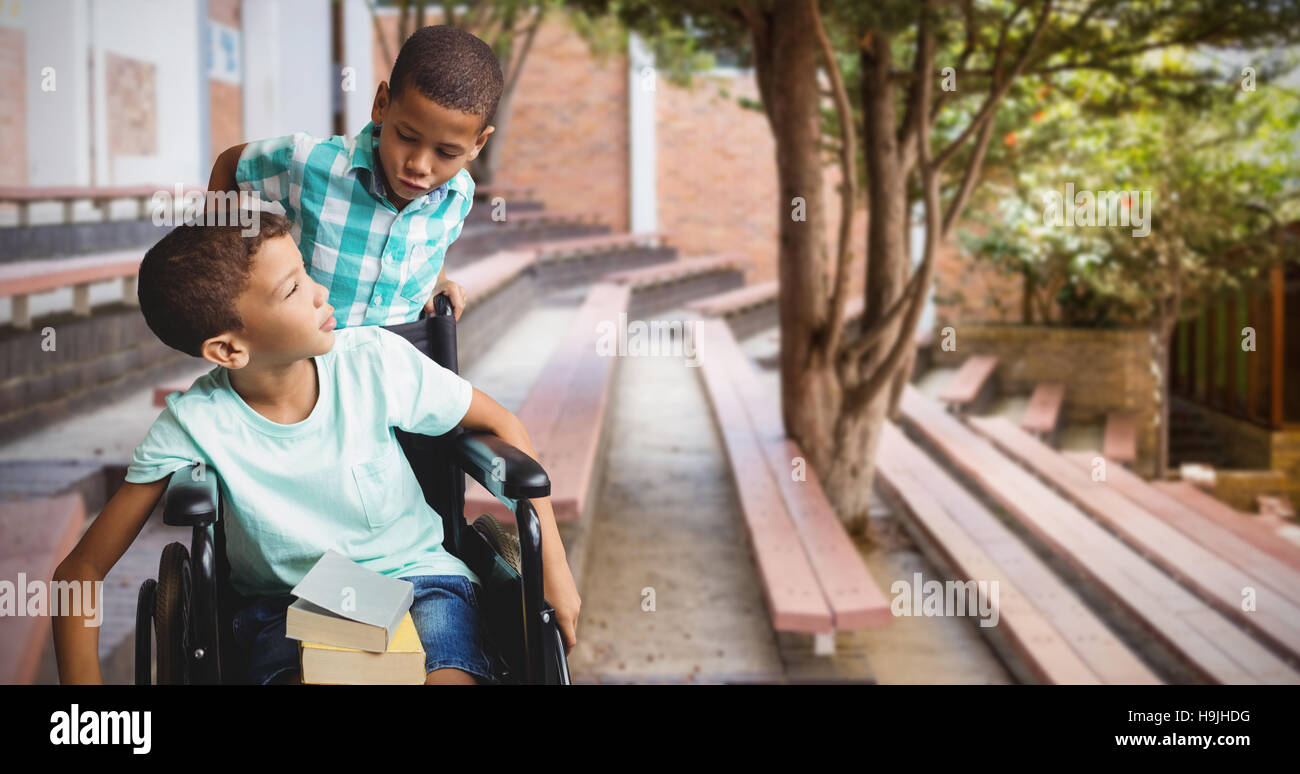 Boy pushing boy wheelchair hi-res stock photography and images - Alamy