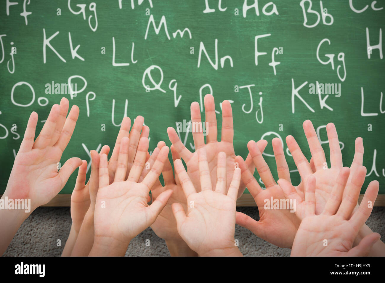 Composite image of people raising hands in the air Stock Photo - Alamy