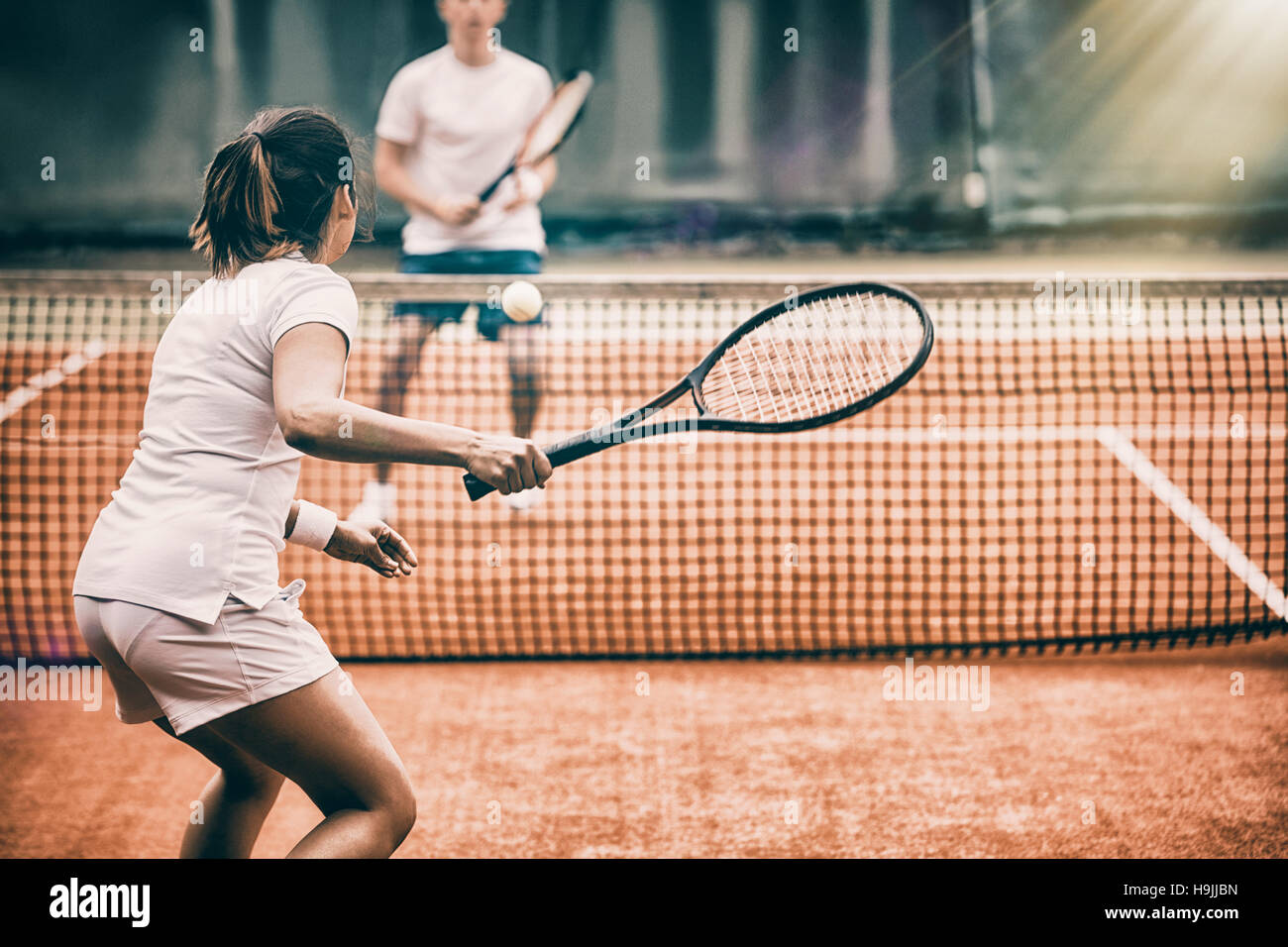 Tennis players playing a match on the court Stock Photo Alamy