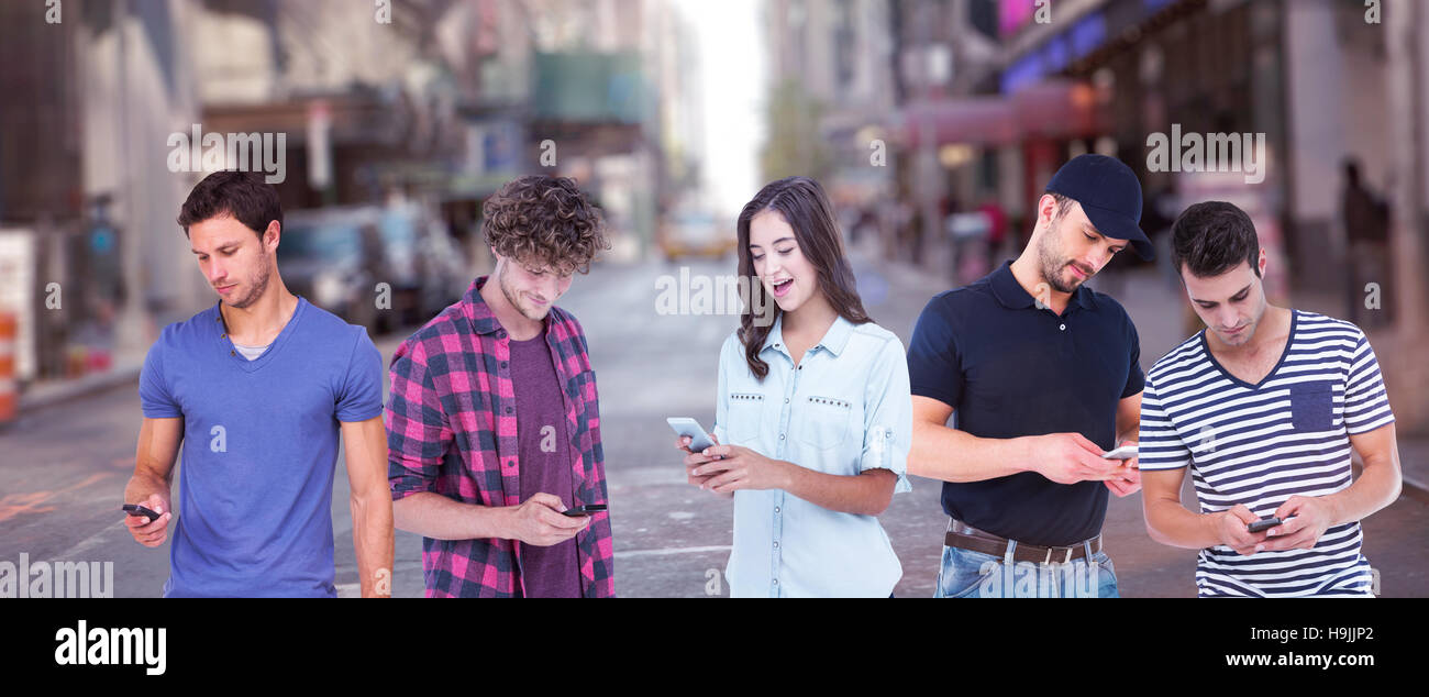 Composite image of handsome man text messaging through smart phone Stock Photo