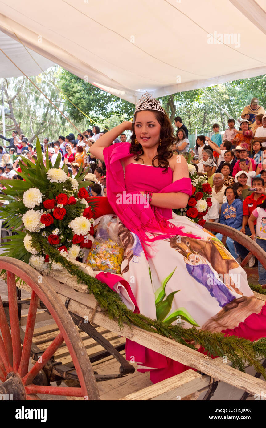 Queen of the Donkey fair in Otumba, Mexico, throwing candies to the audience Stock Photo