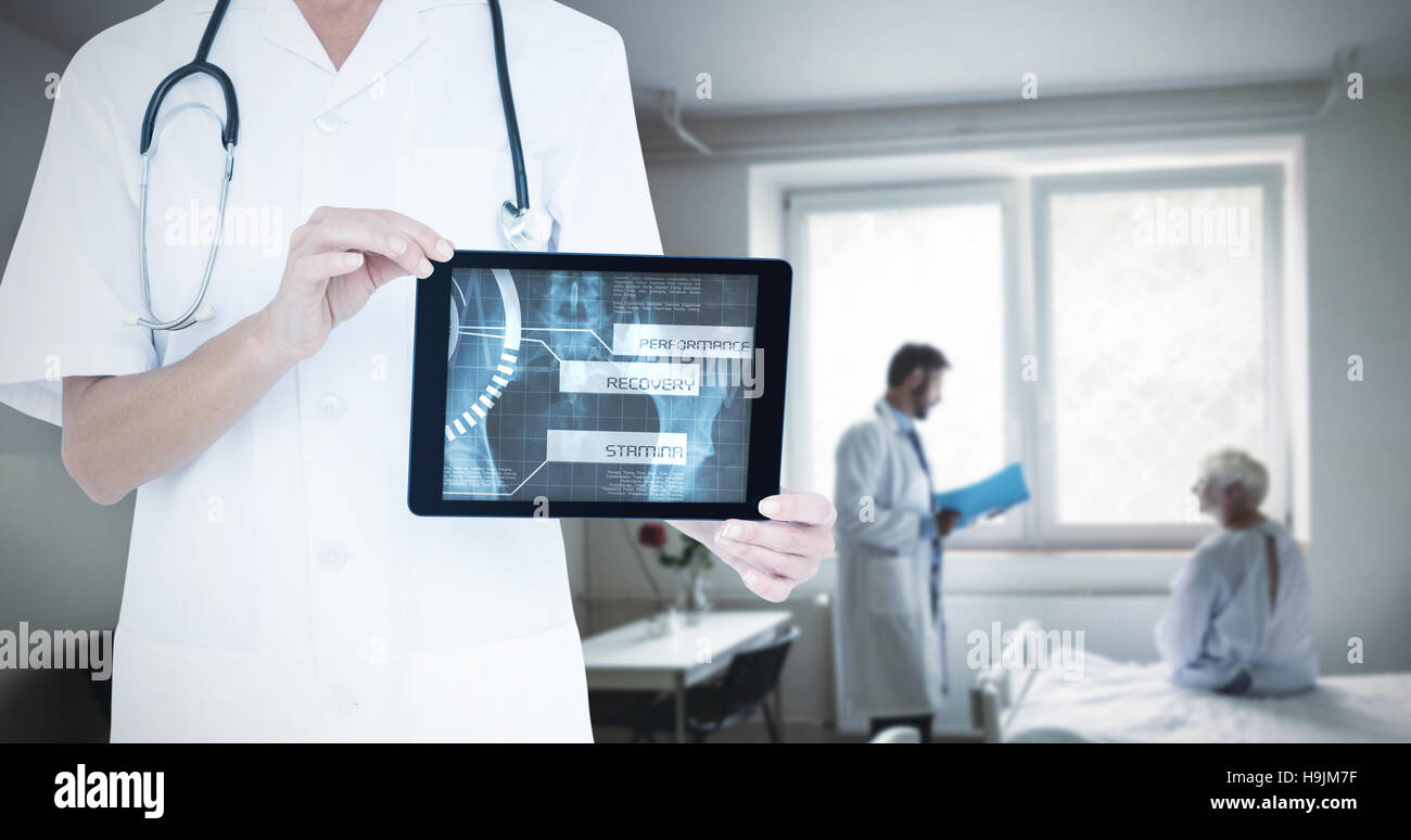 Composite image of midsection of female doctor showing digital tablet Stock Photo