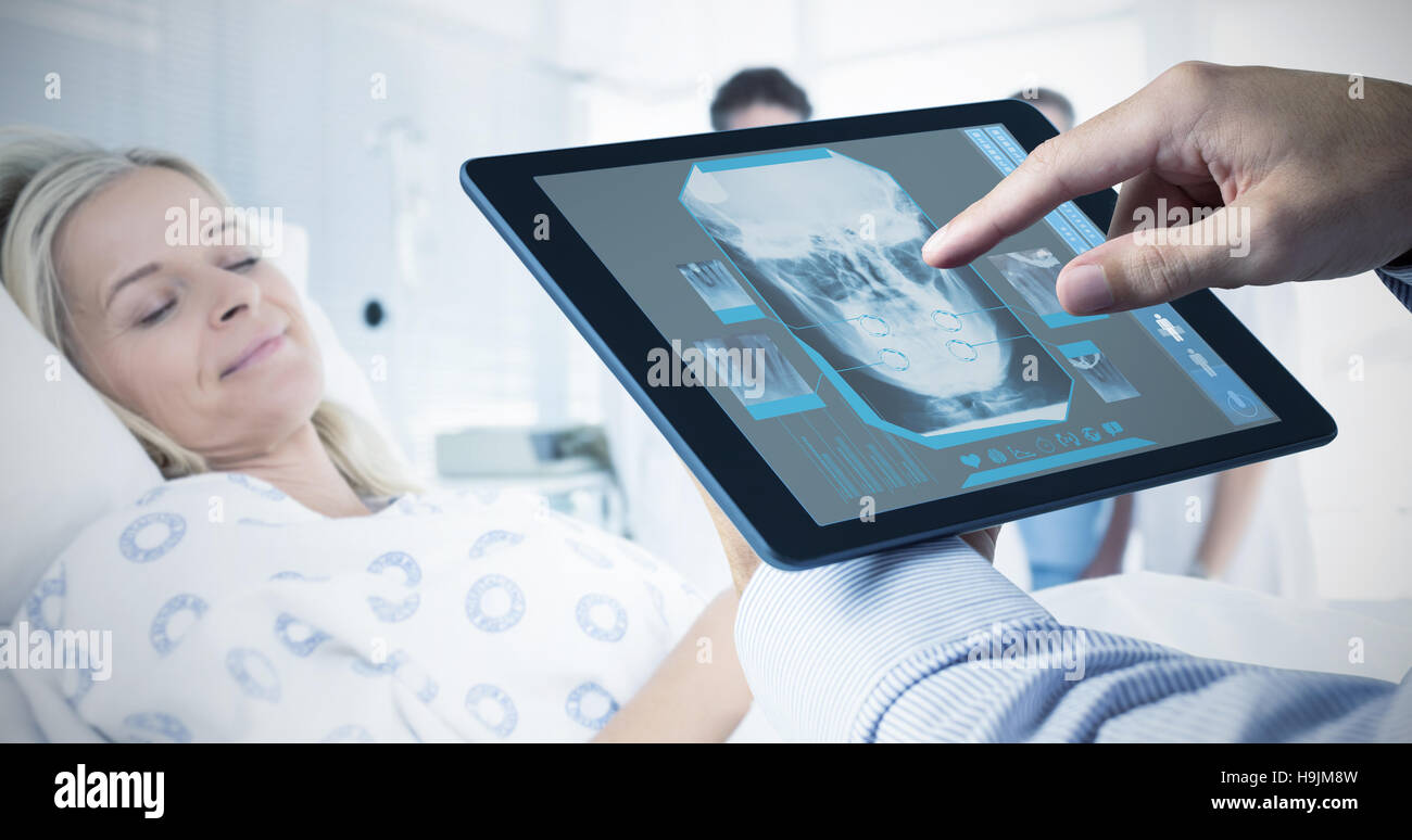 Composite image of man using tablet pc Stock Photo