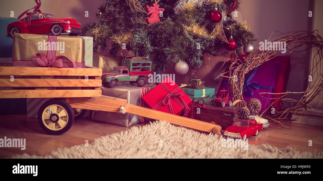 Christmas gifts and christmas tree in living room Stock Photo