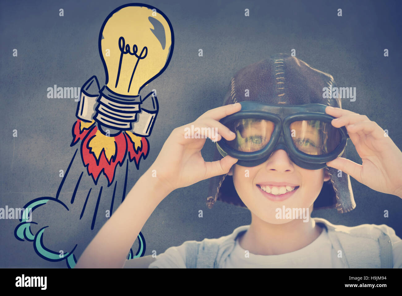 Composite image of portrait image of boy with flying goggles Stock Photo