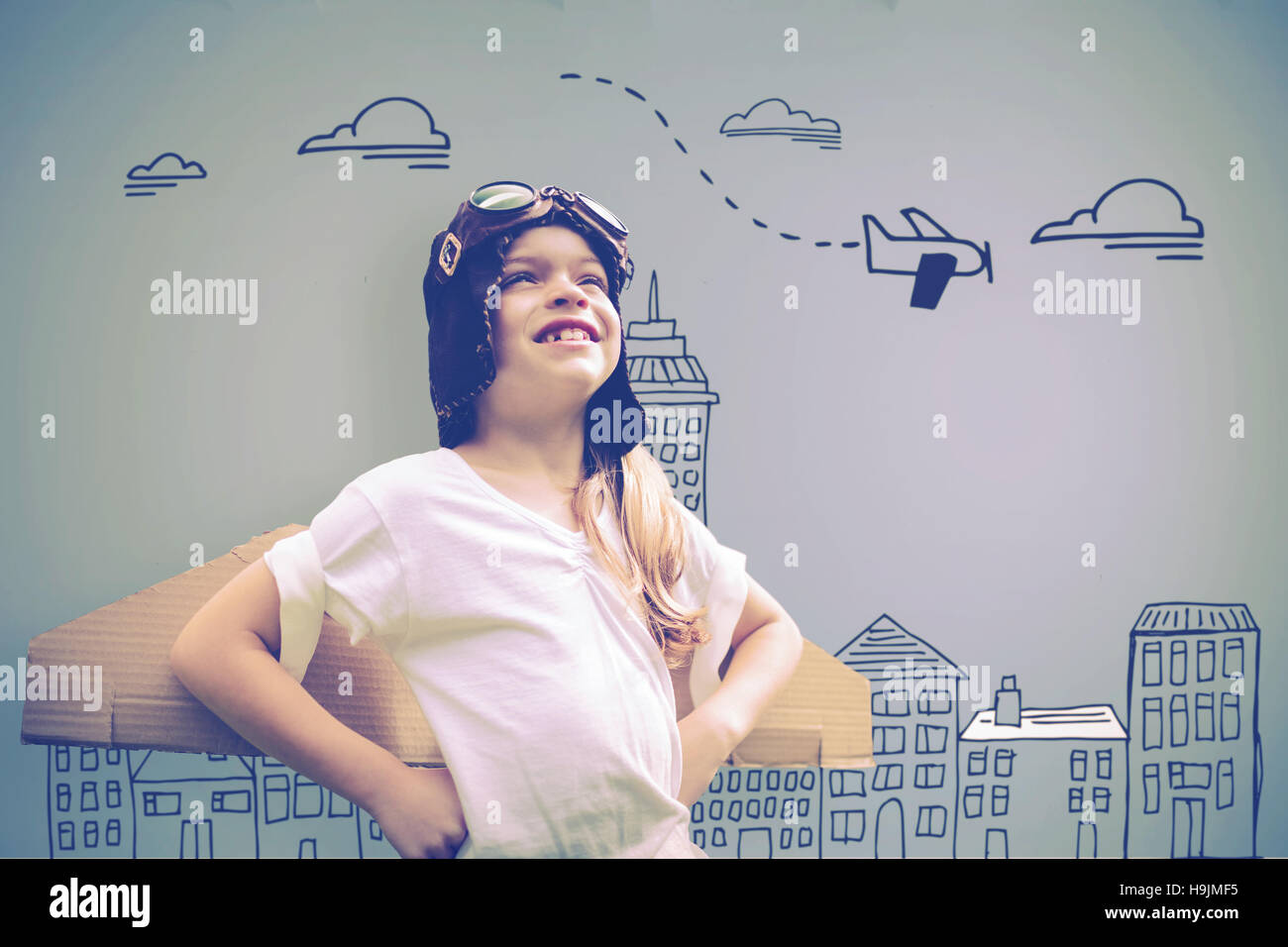 Composite image of girl wearing flying goggles Stock Photo