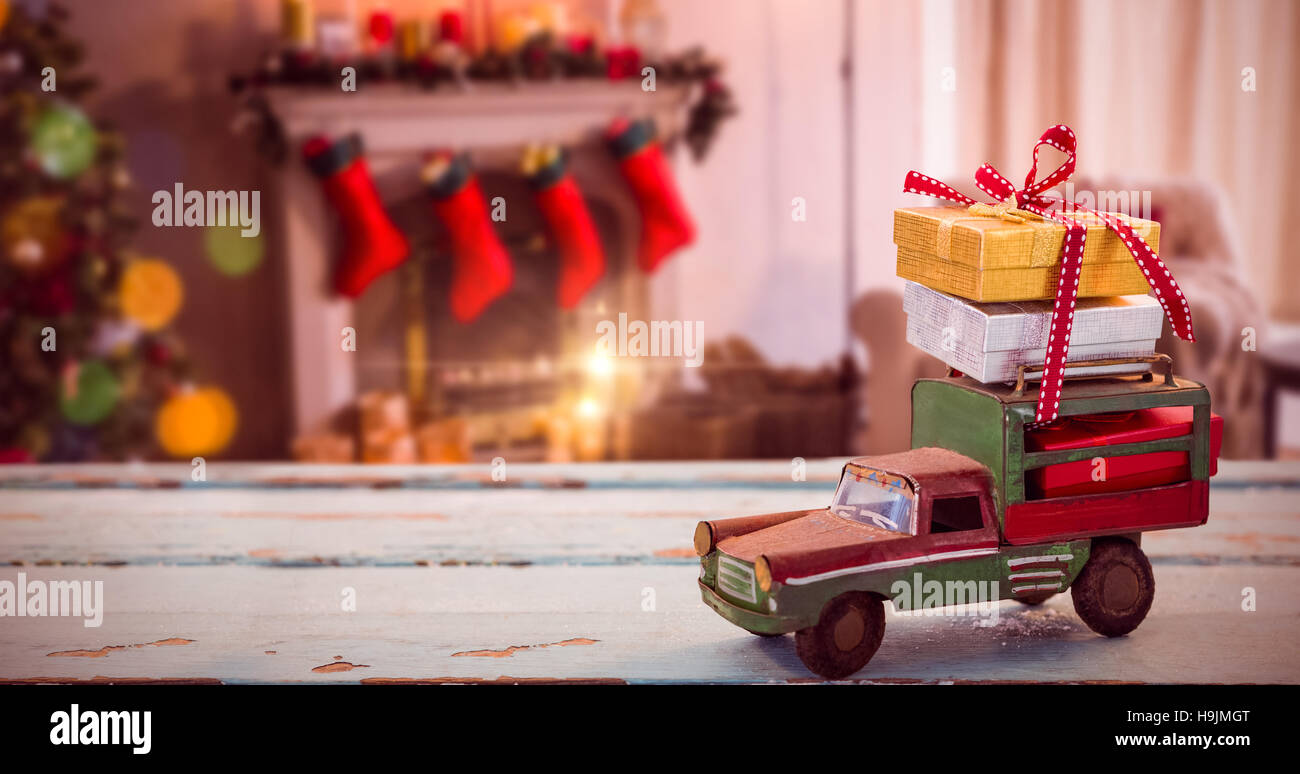 Composite image of car toy on wooden surface Stock Photo