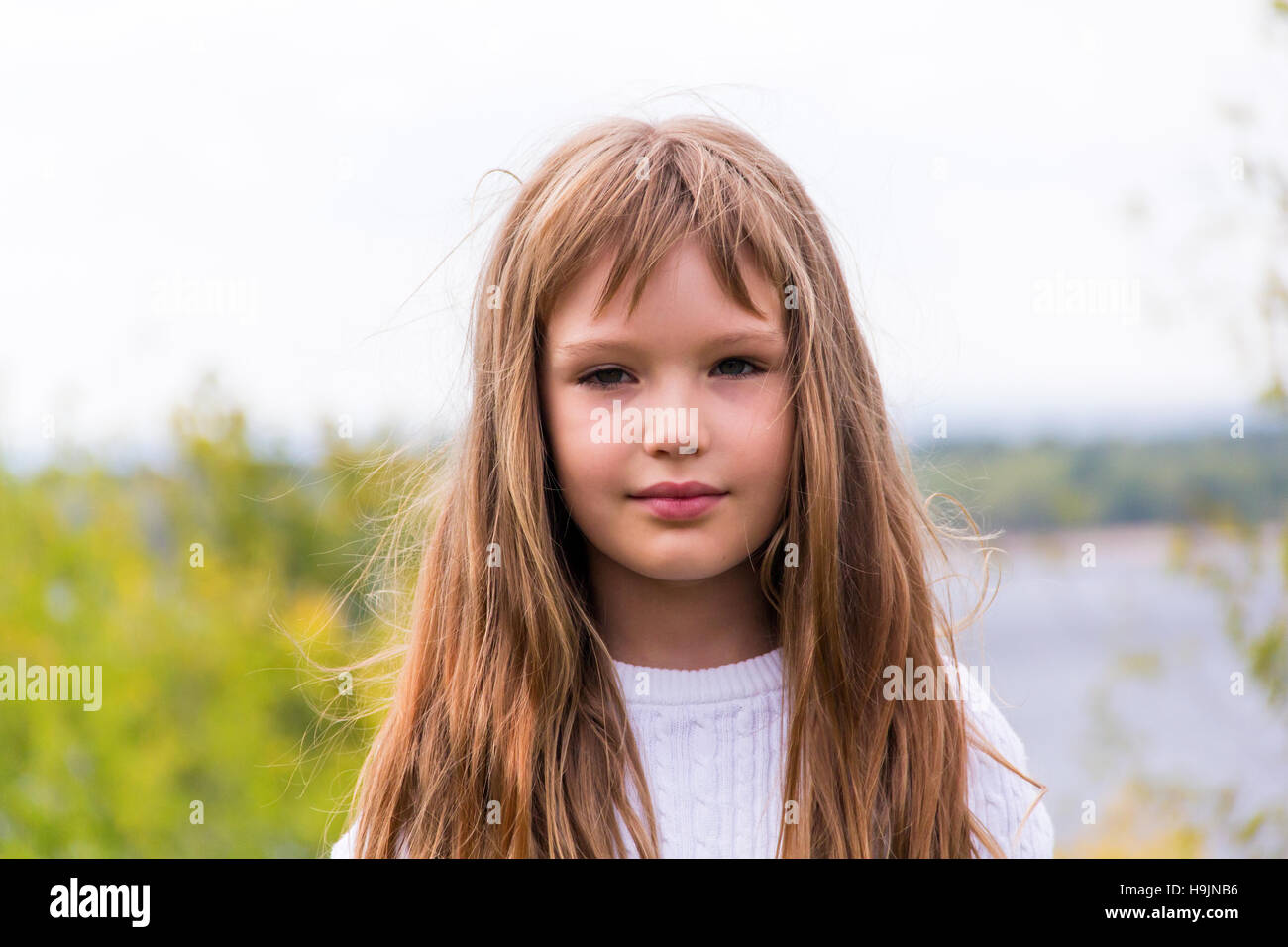 Photo of cute girl with long hair Stock Photo - Alamy