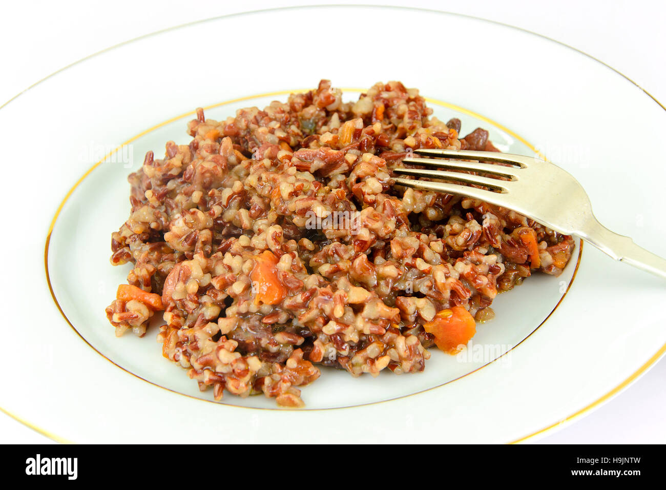 Healthy Food: Pilaf with Meat and Red Rice. Studio Photo Stock Photo