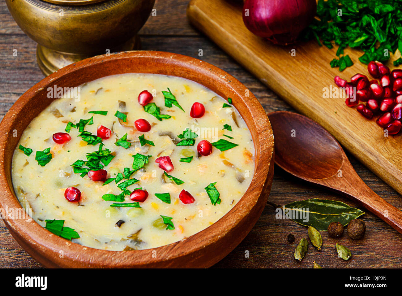 Healthy and Diet Food Soup of Fish with Pomegranate. Studio Photo