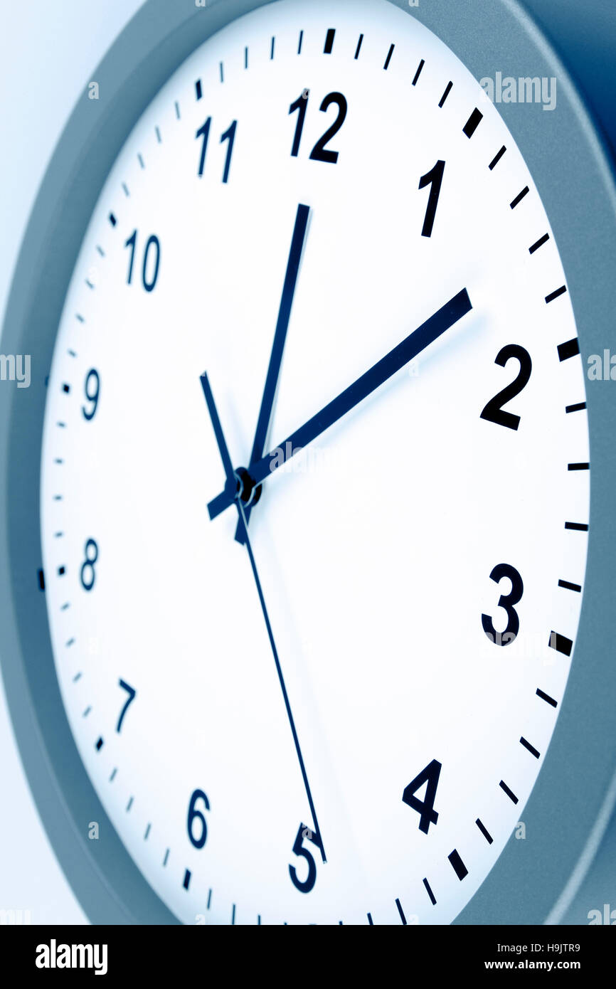 Closeup of hands on clock face Stock Photo Alamy