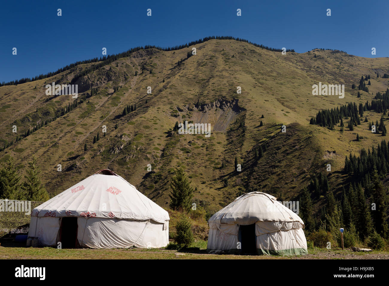 Yurts at a campground of Kaindy Lake in the Kungey Alatau mountain range Kazakhstan Stock Photo