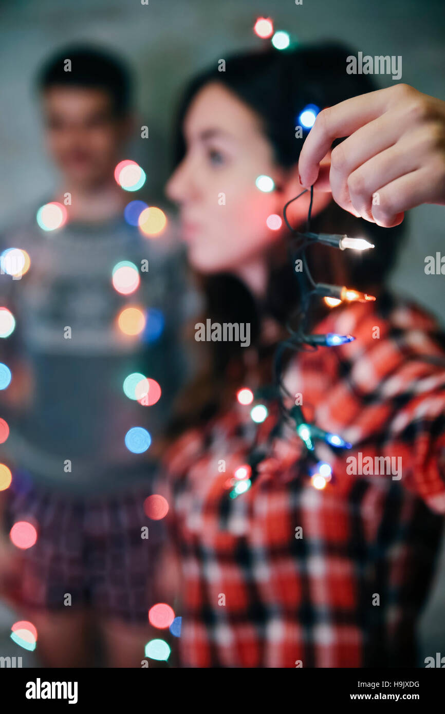 Hand of woman holding fairy lights Stock Photo
