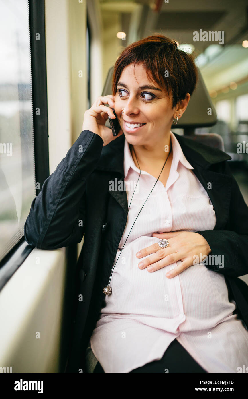 Pregnant woman on train hi-res stock photography and images - Alamy