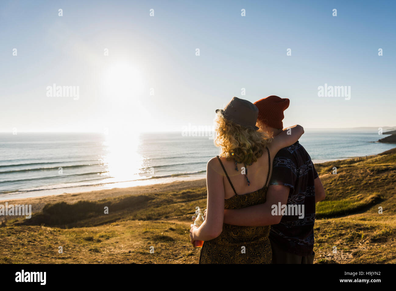 Back view of young couple at seaside Stock Photo