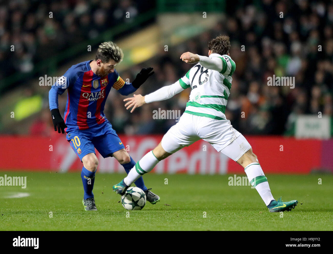 Barcelona S Lionel Messi Left And Celtic S Erik Sviatchenko Right Battle For The Ball During The Uefa Champions League Match At Celtic Park Glasgow Stock Photo Alamy