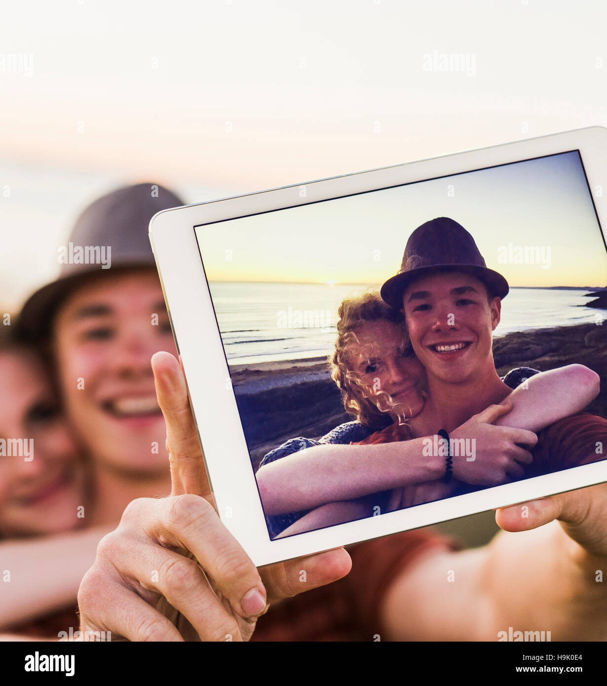 Selfie of young couple on display of tablet Stock Photo