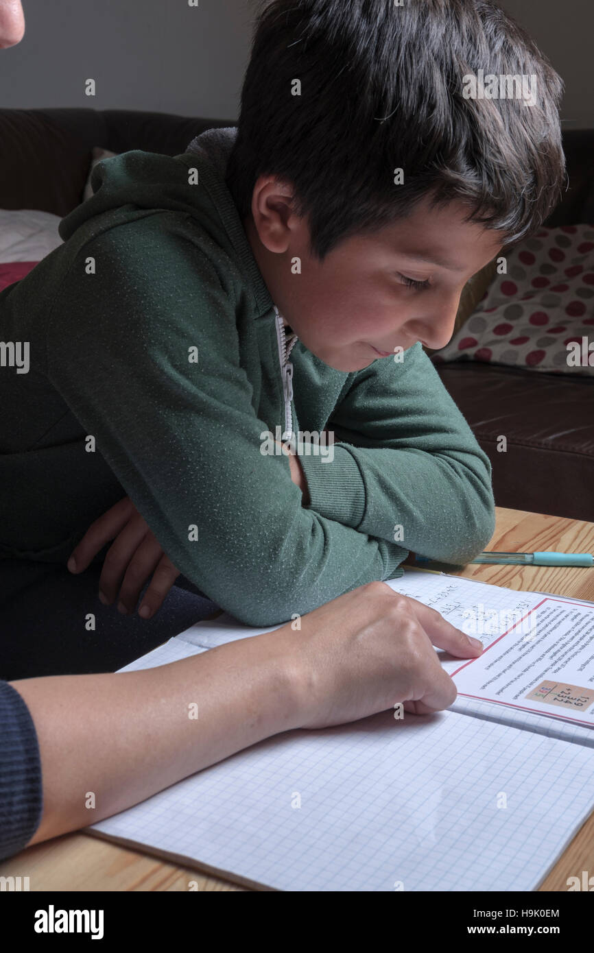 UK, England- Boy having private  maths lesson Stock Photo
