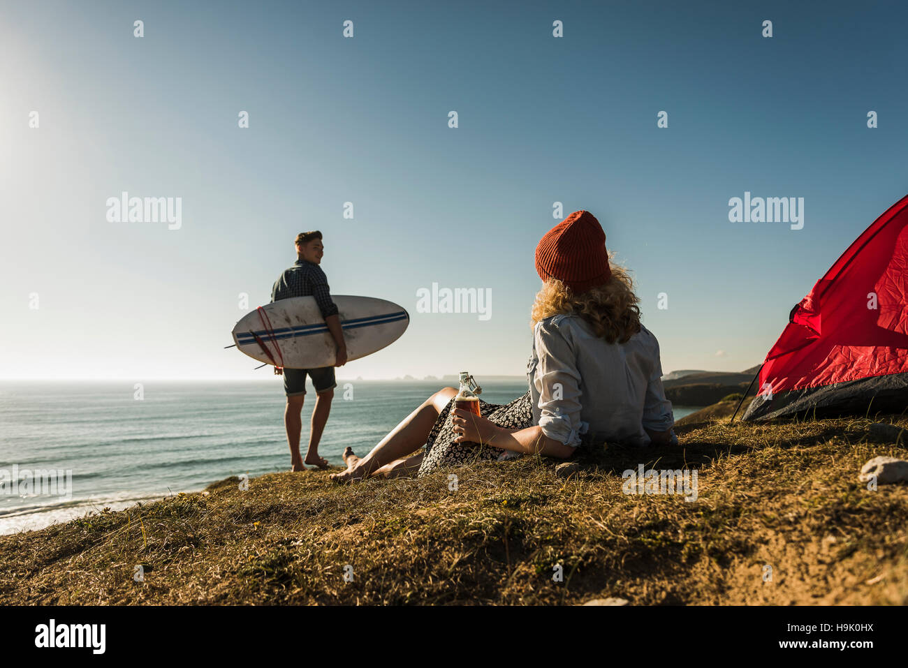 Young couple camping at seaside Stock Photo