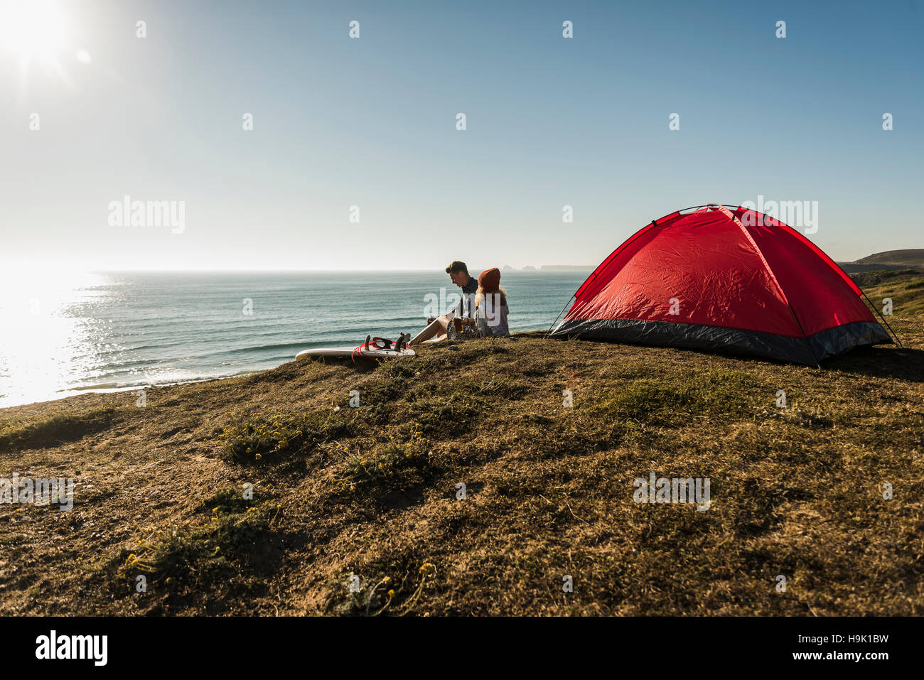 Young couple camping at seaside Stock Photo