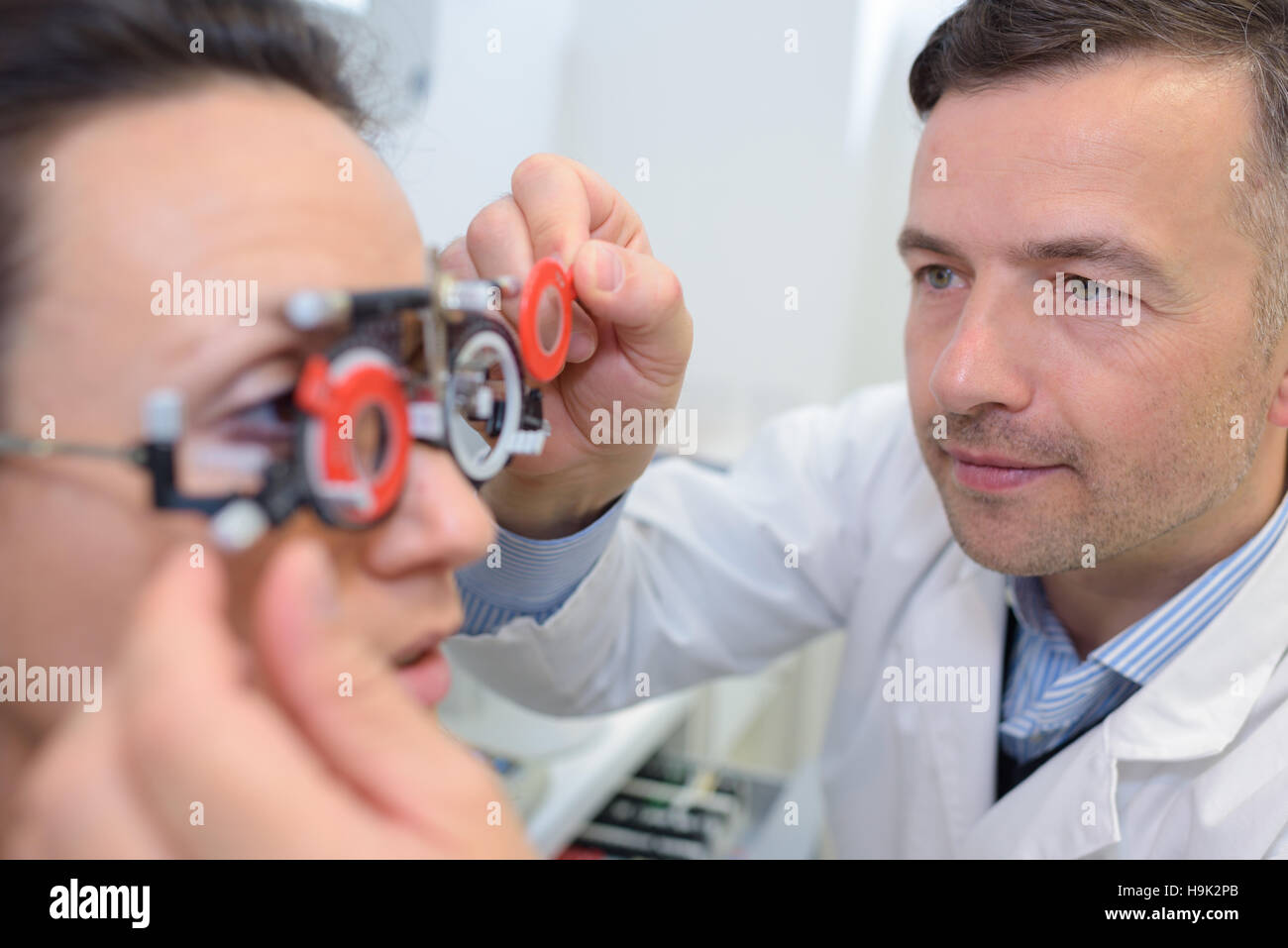 male patient under eye vision examination in correction clinic Stock Photo