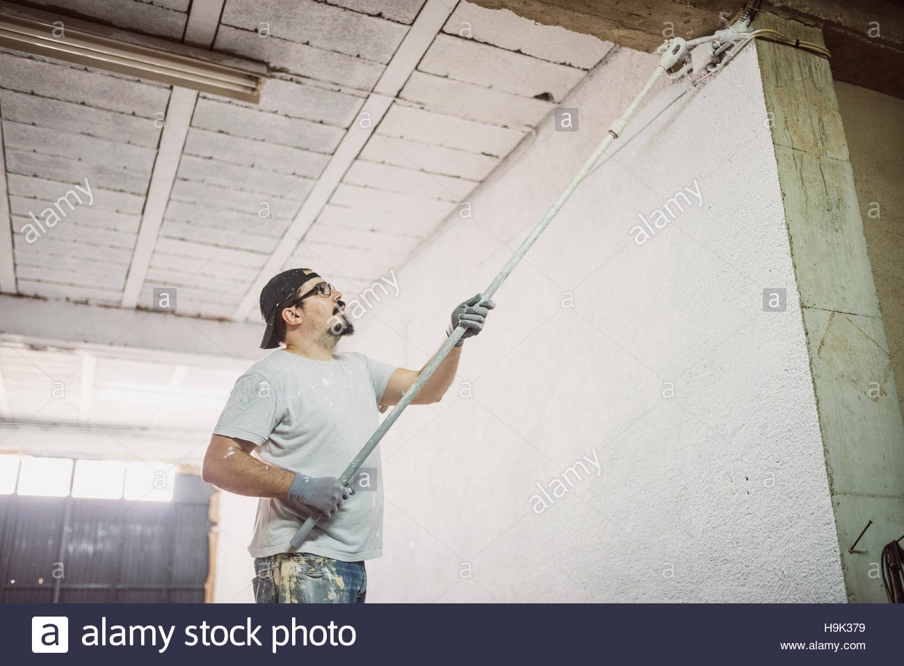 Man Painting Wall In A Garage Stock Photo 126424125 Alamy