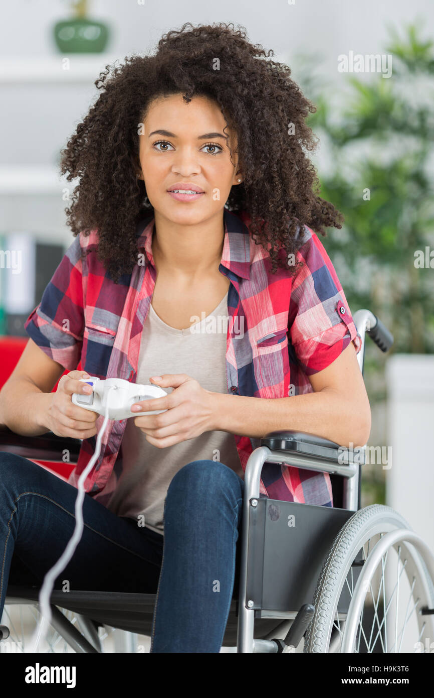 Disabled lady playing computer game Stock Photo Alamy