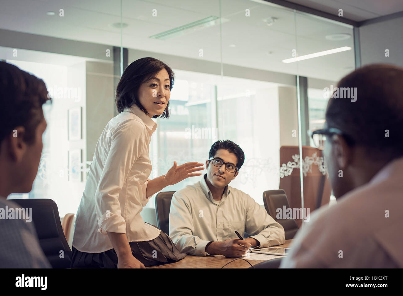 Business people in meeting having interesting discussion Stock Photo