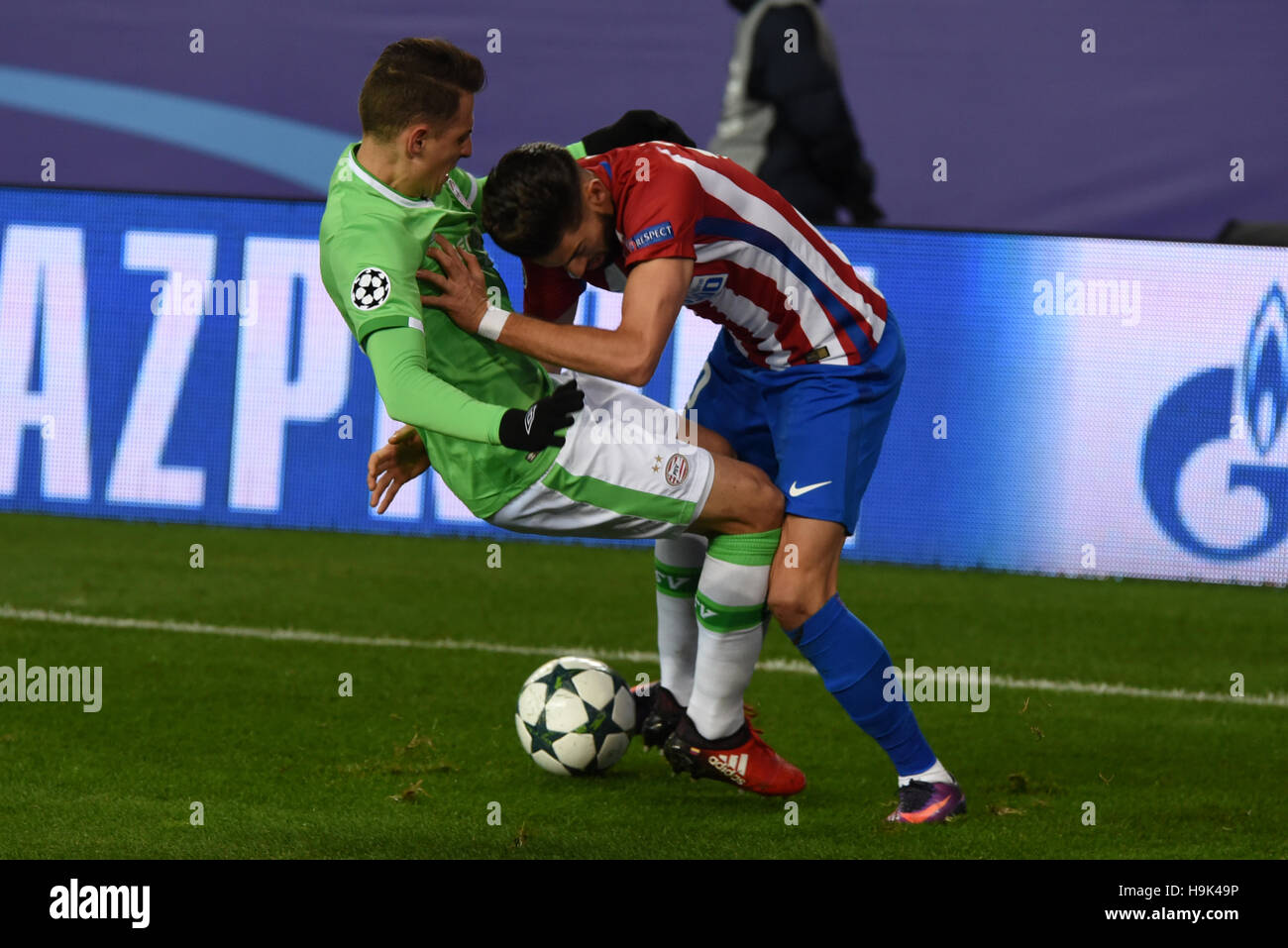 Madrid, Spain. 23rd Nov, 2016. PSV's Santiago Arias and Atletico's Carrasco in action during the UEFA Champions League match between Atlético de Madrid (Spain) and PSV Eindhoven (Netherlands) at Vicente Calderón stadium. Atletico de Madrid beat PSV (2-0) in the Champions League Group D match played at the Vicente Calderón in Madrid. Credit:  Jorge Sanz/Pacific Press/Alamy Live News Stock Photo
